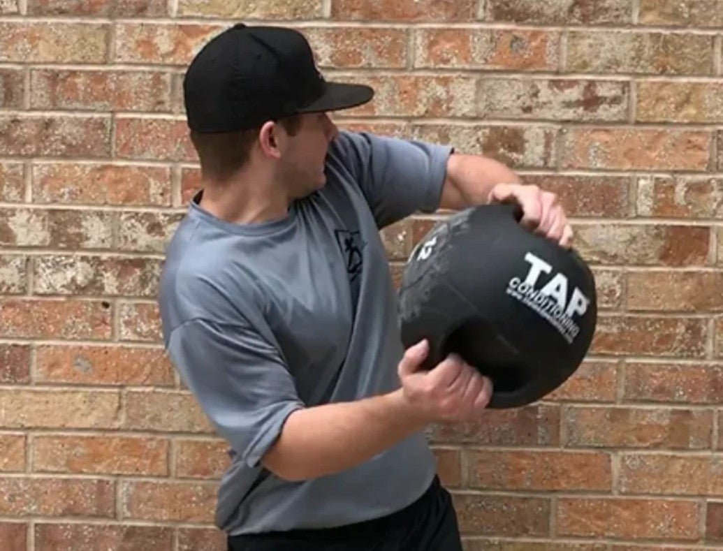 Médecine-ball à double poignée TAP® pour l'entraînement sportif en rotation
